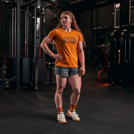 Playera SBD para mujer naranja uso casual powerlifting