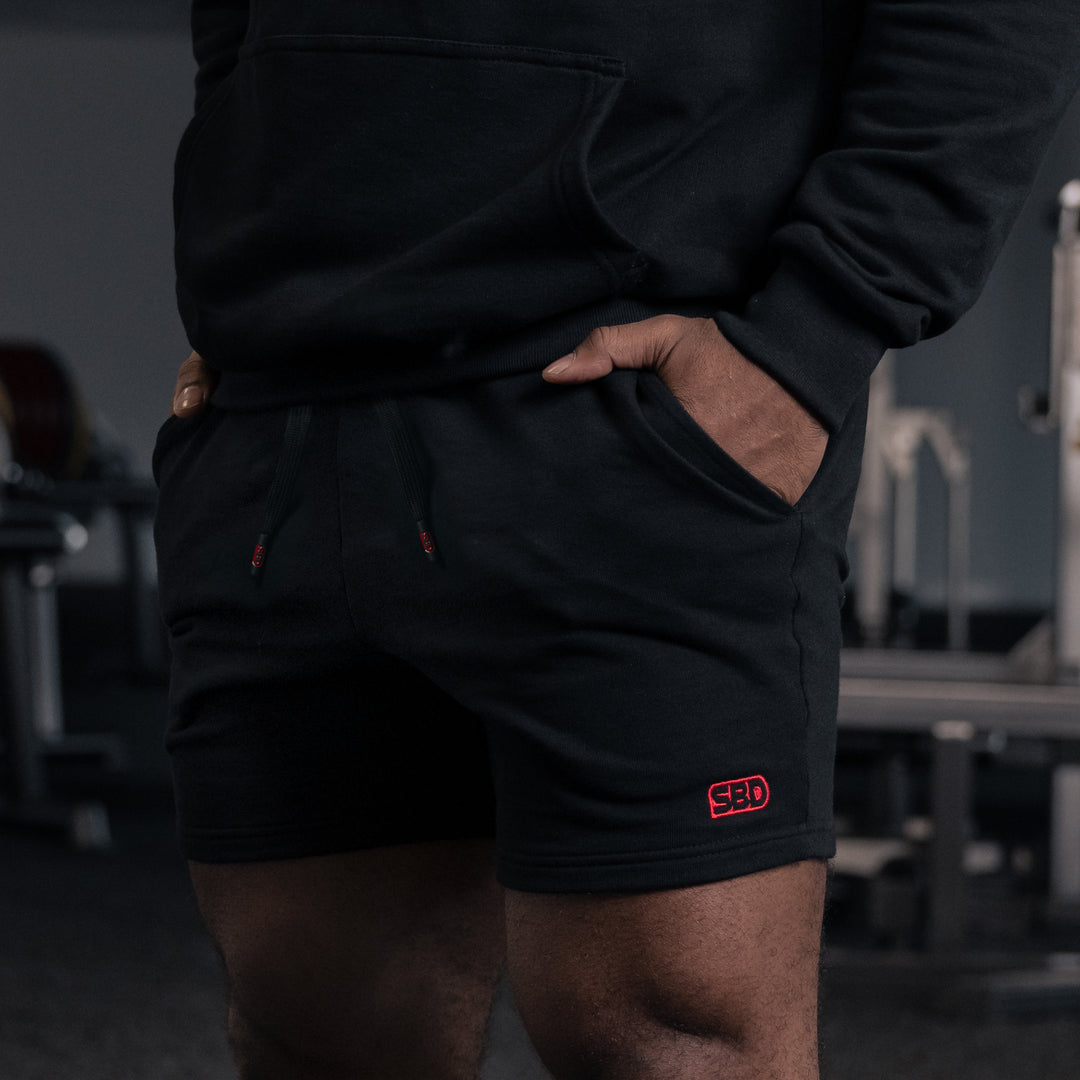 Shorts SBD negros con logo rojo para powerlifters