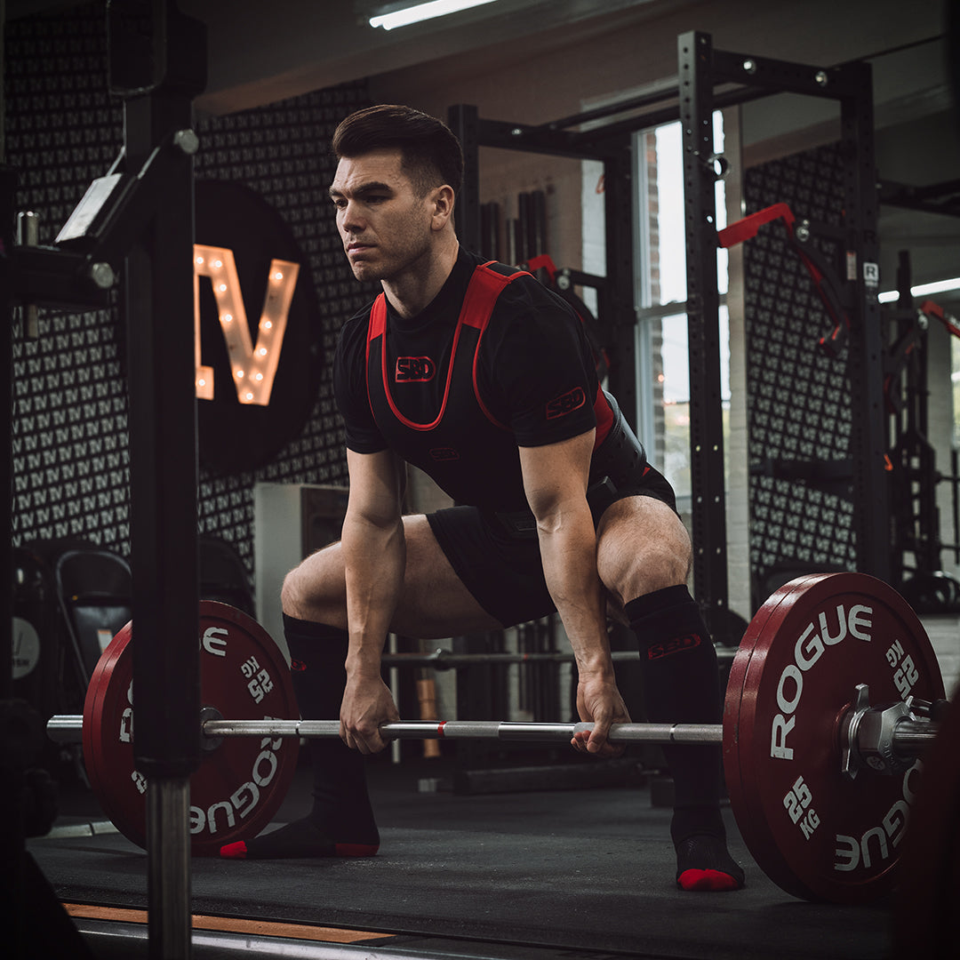 SBD Singlet negro con detalles en rojo para powerlifting